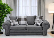Gray sofa with plaid cushions in a living room setting