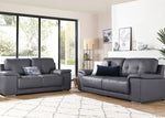 Gray leather sofa set in a modern living room with large windows.