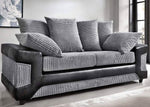 Gray sofa with striped cushions in a room with large windows.