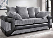Gray sofa with striped cushions in a room with large windows.