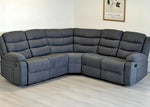 Gray sectional sofa in a room with a light-colored floor and wall.