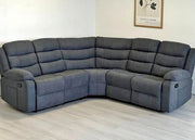 Gray sectional sofa in a room with a light-colored floor and wall.