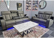 Gray leather sofa set with marble coffee table in a living room setting.