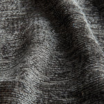 Close-up of textured gray fabric with a subtle pattern