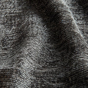 Close-up of textured gray fabric with a subtle pattern