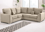 Beige sectional sofa in a living room setting with a patterned rug.