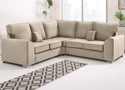 Beige sectional sofa in a living room setting with a patterned rug.