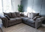 Gray sectional sofa in a living room with a modern decor.