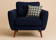 Navy blue armchair with a patterned pillow on a beige background