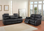 Black leather recliner sofa set in a living room with large windows.